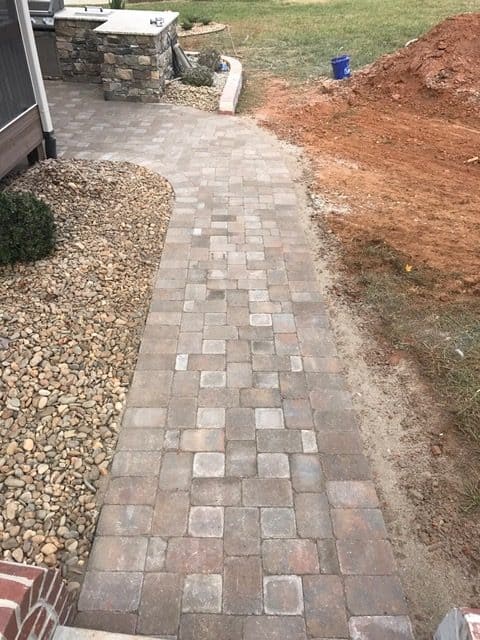 Backyard Sidewalks by Garrisons Landscaping